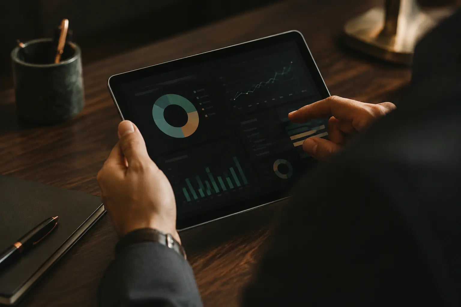 A professional reviewing an operational dashboard on a tablet