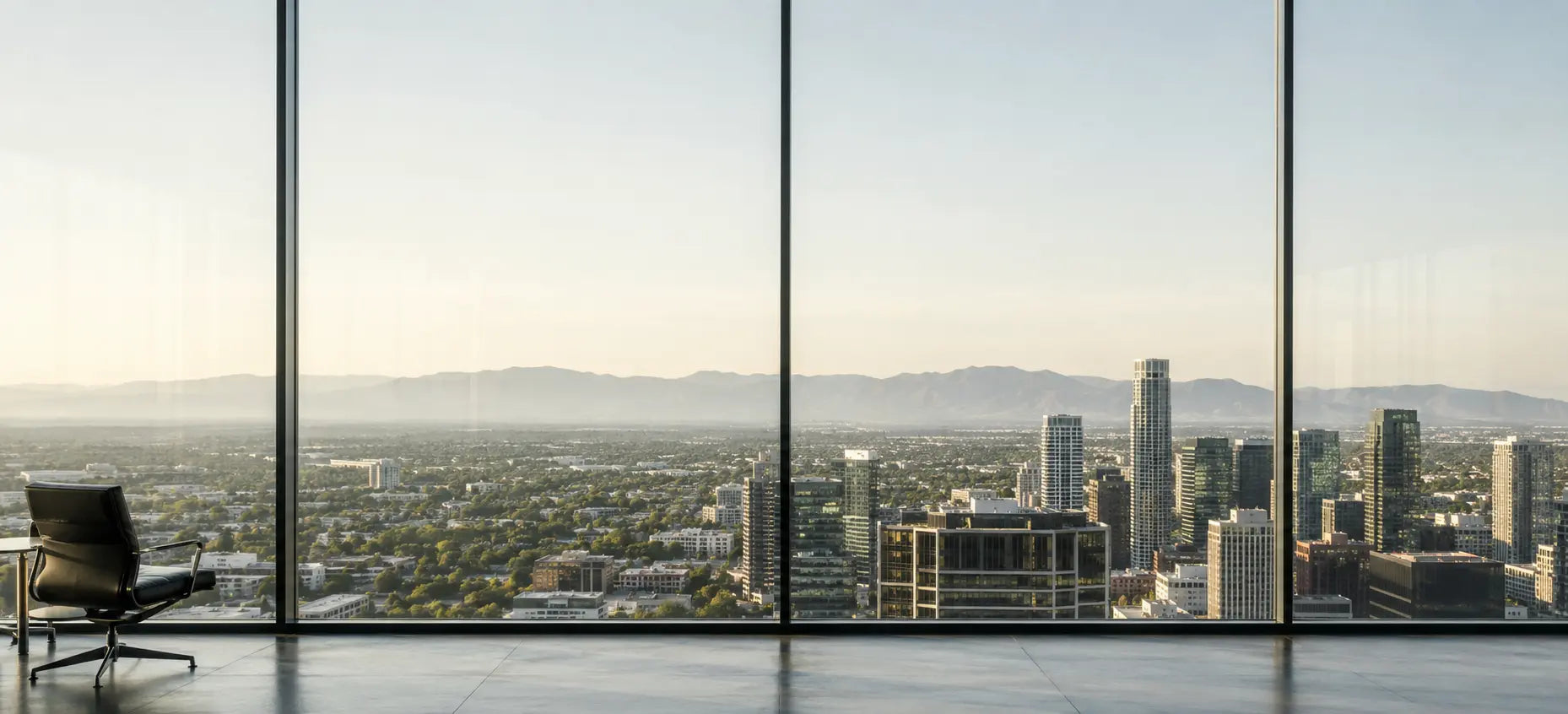 Daylight city view from an executive workspace